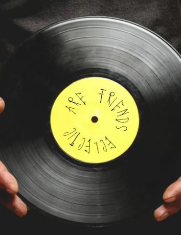 image of dj holding vinyl record for eclectic radio show