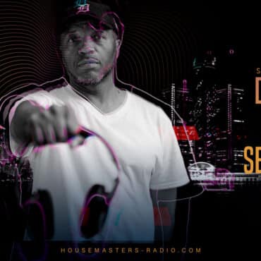 dj producer santonio echols holding headphones infront of Detroit skyline