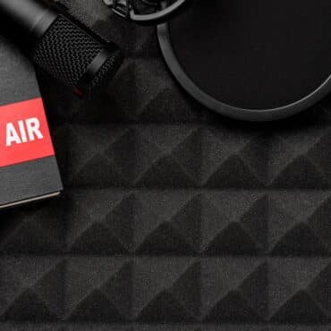 How to start a podcast banner showing a microphone and on air light