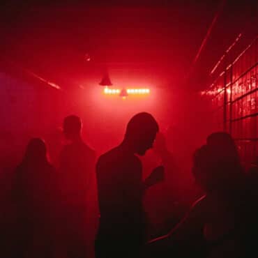 Nightclub Evacuated After Chemical Release. image showing inside the nightclub with red lights