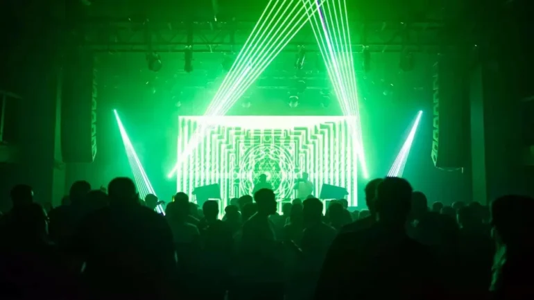 green lasters shines over the heads of clubbers inside Birmingham's club forum.