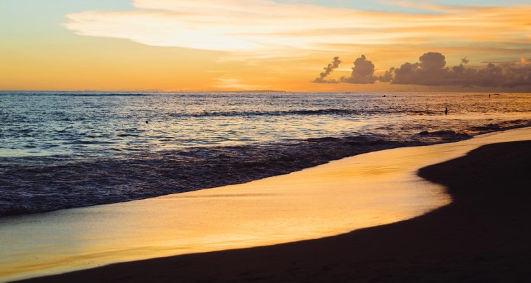 absolute beach radio show banner showing a beautiful sunset